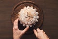 Man cutting cake on wooden kitchen table Royalty Free Stock Photo