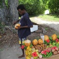 Man cutting a coconut