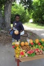 Man cutting a coconut