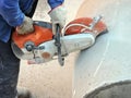 Man cutting concrete pipe Royalty Free Stock Photo