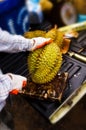 Man cutting Durian in the street