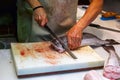 Man cutting fish on fish market Royalty Free Stock Photo