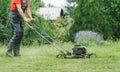 Man cutting grass with lawnmower Royalty Free Stock Photo