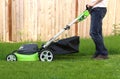 Man cutting the grass with lawn mower Royalty Free Stock Photo