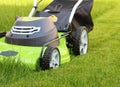 Man cutting the grass with lawn mower Royalty Free Stock Photo
