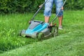 Man cutting the grass with a lawn mower Royalty Free Stock Photo