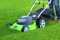 Man cutting the grass with lawn mower Royalty Free Stock Photo