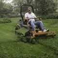 Man cutting grass on lawnmower Royalty Free Stock Photo