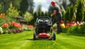 Man rolls lawn mower over green grass with vehicle