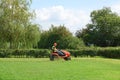 Man cutting grass on tractor mower