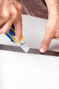 Worker cuts with a knife drywall repair Royalty Free Stock Photo