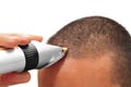 Man cutting his hair with an electric hair clipper Royalty Free Stock Photo