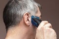 Man cutting his own hair with a clipper Royalty Free Stock Photo