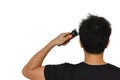 Man cutting his own messy hair with a clipper when quarantine time Royalty Free Stock Photo