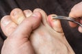 Man cutting nails on his foot Royalty Free Stock Photo