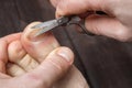 Man cutting nails on his foot - pedicure Royalty Free Stock Photo