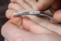 Man cutting nails on his foot Royalty Free Stock Photo