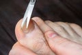 Man cutting nails on his foot - pedicure Royalty Free Stock Photo