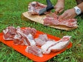 Man cutting rack of lamb on wooden board Royalty Free Stock Photo