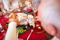 Man cutting roasted turkey on a table background. Family enjoying autumn holidays. Thanksgiving dinner concept. Royalty Free Stock Photo