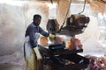 A man cutting rock salt to make tiles Royalty Free Stock Photo