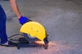 A man cutting steel with a electric steel cutter machine Royalty Free Stock Photo