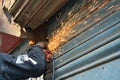 Man cutting Steel Plate with circular grinder cutter Royalty Free Stock Photo