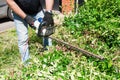 man cutting and trimming bushes