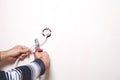 Man cutting wire with pliers. Royalty Free Stock Photo