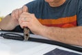 Man cutting a wire tie for a solar panel connection on a recreational vehicle. Royalty Free Stock Photo