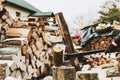 Woodcutter working with an axe at sawmill