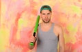 Man in cyan green cap on colorful background. Royalty Free Stock Photo