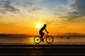 Man cycling at beach evening time Royalty Free Stock Photo