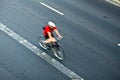 Man cycling on city street, motion Royalty Free Stock Photo