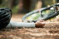 Man, cycling and fall on forest trail from fitness, workout and training accident on bike lying on ground. Dirt road Royalty Free Stock Photo