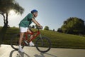 Man Cycling In Park At Dusk Royalty Free Stock Photo