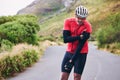 Man, cyclist and arm injury in fitness accident, emergency or broken bone on mountain road in nature. Male person or Royalty Free Stock Photo