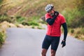 Man, cyclist and neck injury in nature accident, emergency or broken bone on mountain road. Male person or athlete with Royalty Free Stock Photo