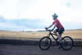 man cyclist rides a bike on a road in nature. sports, cycling and health hobbies Royalty Free Stock Photo