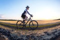 man cyclist rides a bike on a road in nature. sports, cycling and health hobbies Royalty Free Stock Photo