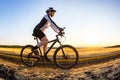 man cyclist rides a bike on a road in nature. sports, cycling and health hobbies Royalty Free Stock Photo