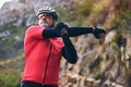 Man, cyclist and stretching body on mountain in sports fitness, workout or outdoor exercise in nature. Active male Royalty Free Stock Photo