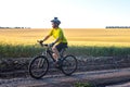 man cyclist in yellow clothes rides a bike on a road in nature. sports, hobbies and entertainment for health Royalty Free Stock Photo