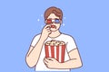 Man in 3D glasses eating popcorn