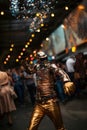 Man dancing in disco. Man dressed in Futuristic Silver Suit. Robot suit.