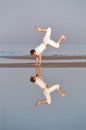 Man is dancing near the sea Royalty Free Stock Photo