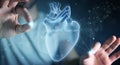 Man using digital x-ray of human heart holographic scan projection 3D rendering Royalty Free Stock Photo