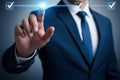 Man in blue suit touching digital checklist with glowing checkmarks white shirt Royalty Free Stock Photo
