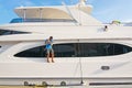 Man on deck on luxury yacht in Puerto Portals marina