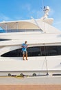 Man on deck on luxury yacht in Puerto Portals marina